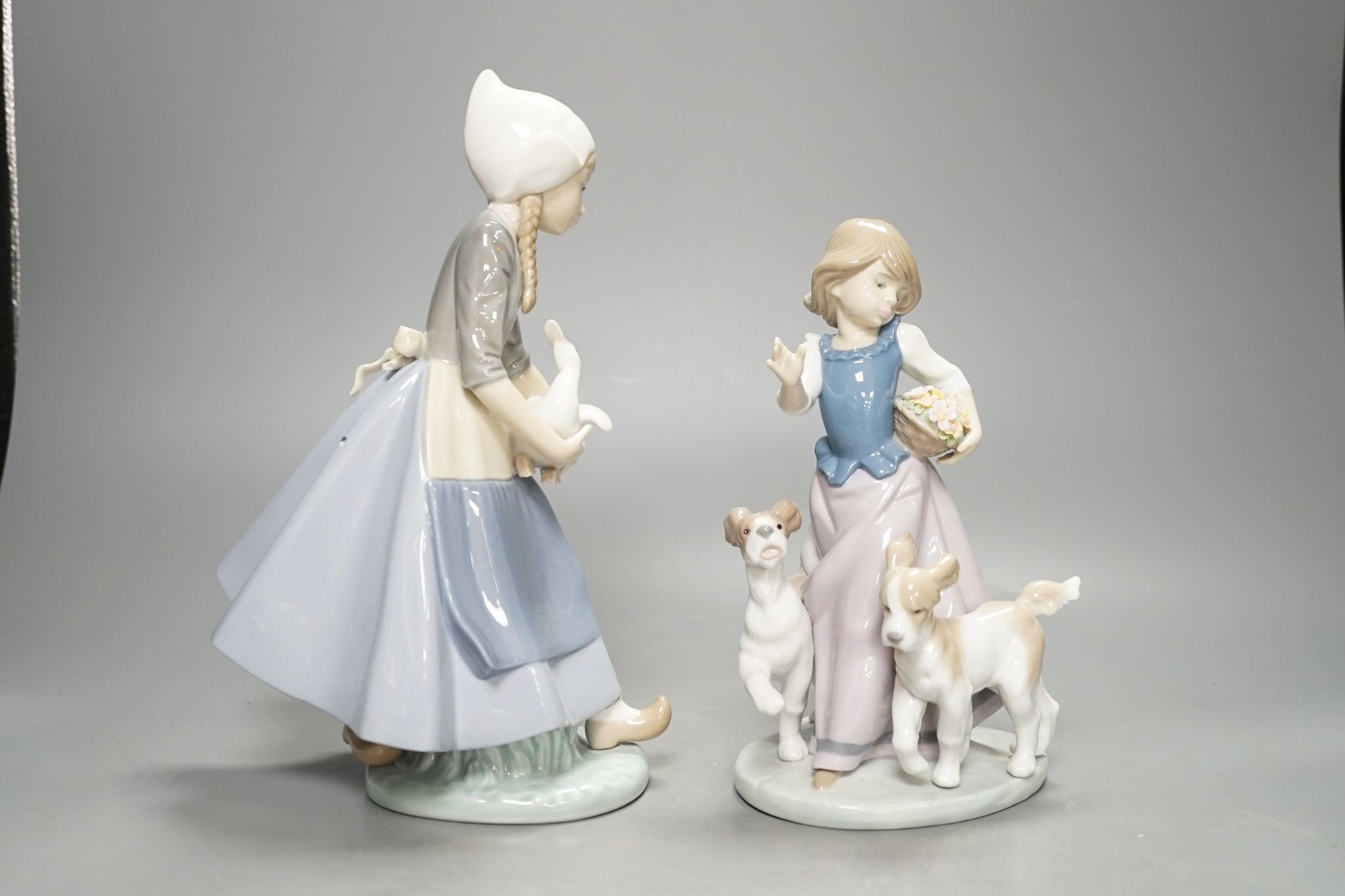 Two Lladro figure groups, tallest 26 cm